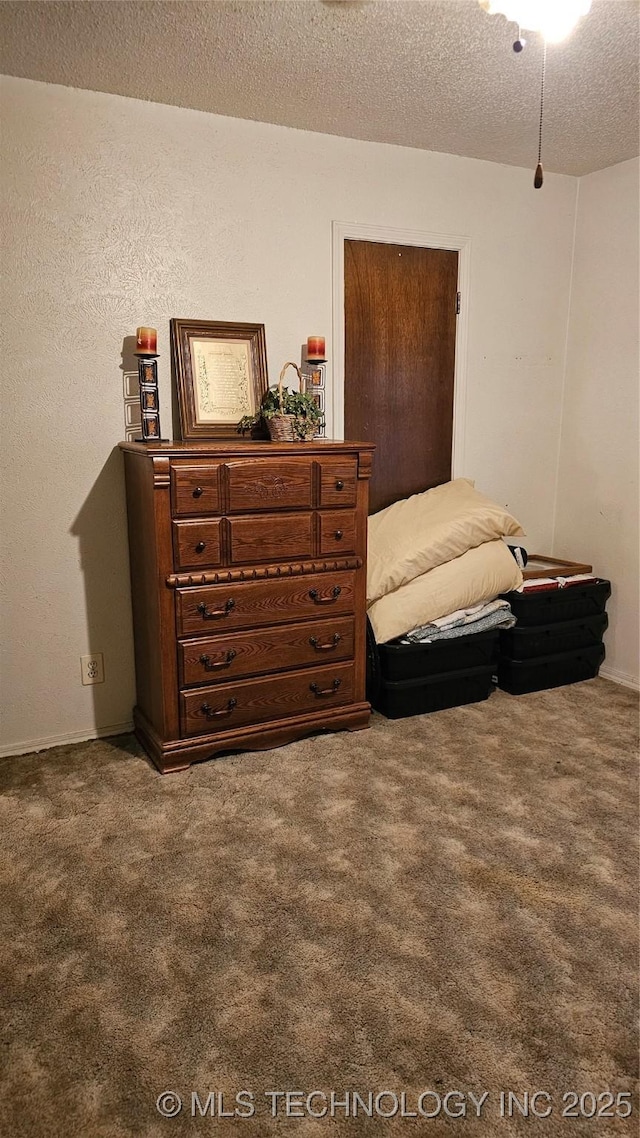 carpeted bedroom with a textured ceiling