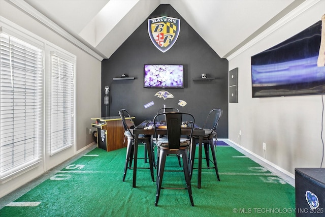 dining area with lofted ceiling, plenty of natural light, and carpet