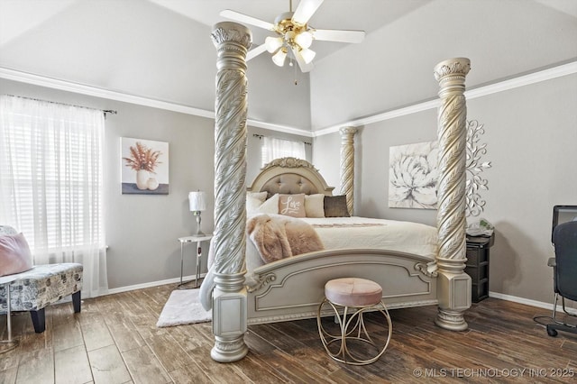 bedroom with wood-type flooring, ornamental molding, ceiling fan, and vaulted ceiling