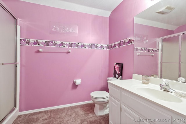 bathroom featuring vanity, toilet, visible vents, and a stall shower