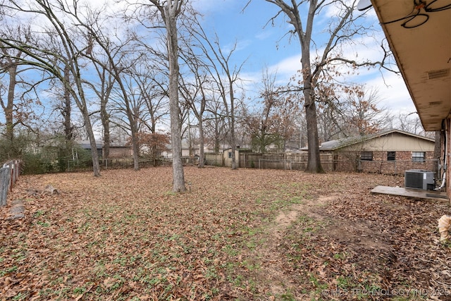 view of yard with central AC