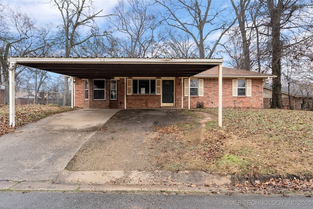 ranch-style house with a carport