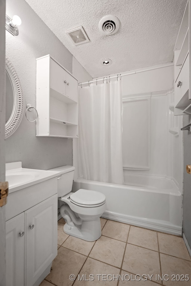 full bathroom with tile patterned floors, toilet, a textured ceiling, vanity, and shower / bathtub combination with curtain