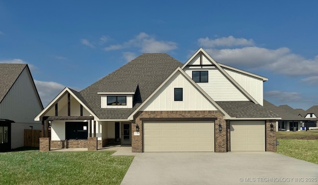 view of front of house with a garage and a front lawn