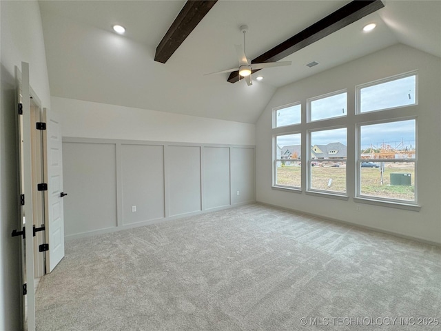 bonus room featuring lofted ceiling with beams, light carpet, and ceiling fan