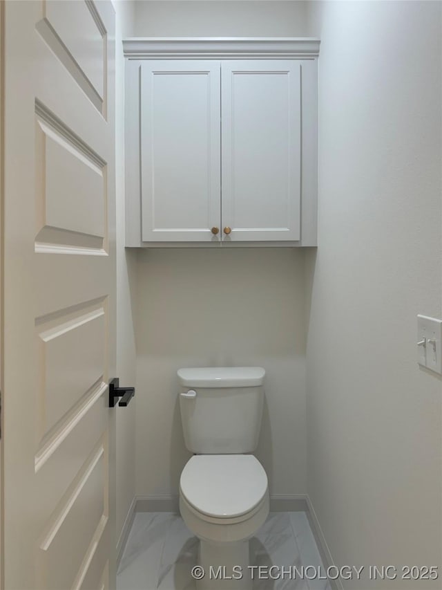 bathroom featuring toilet