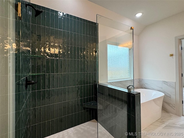 bathroom with independent shower and bath, lofted ceiling, and tile walls