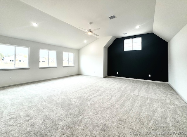 bonus room with vaulted ceiling, ceiling fan, and carpet