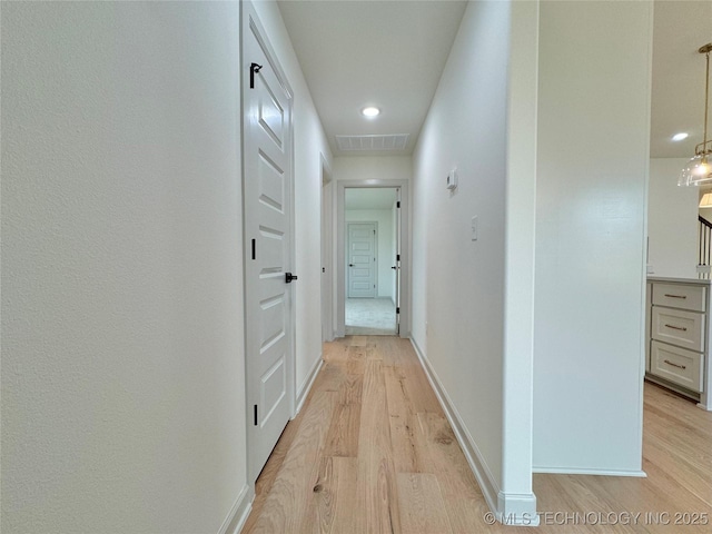 hall featuring light hardwood / wood-style floors