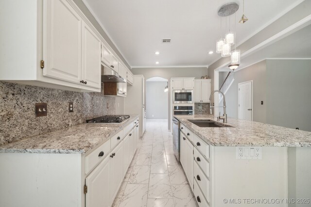 kitchen with visible vents, a sink, appliances with stainless steel finishes, and white cabinets
