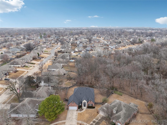 birds eye view of property with a residential view