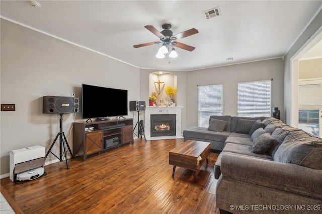 living room with hardwood / wood-style floors and ceiling fan