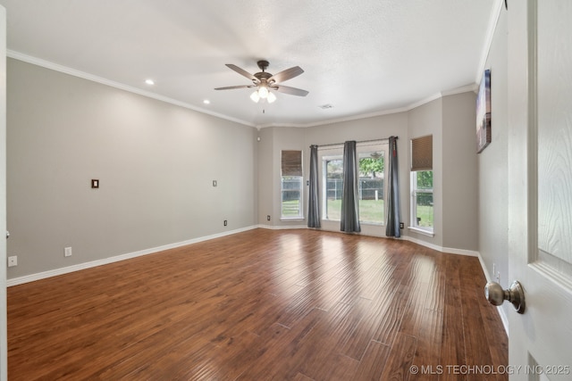 spare room with baseboards, a ceiling fan, and wood finished floors
