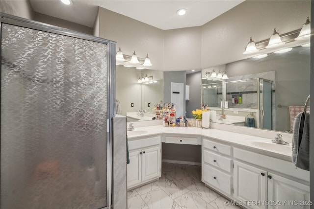 bathroom with walk in shower and vanity