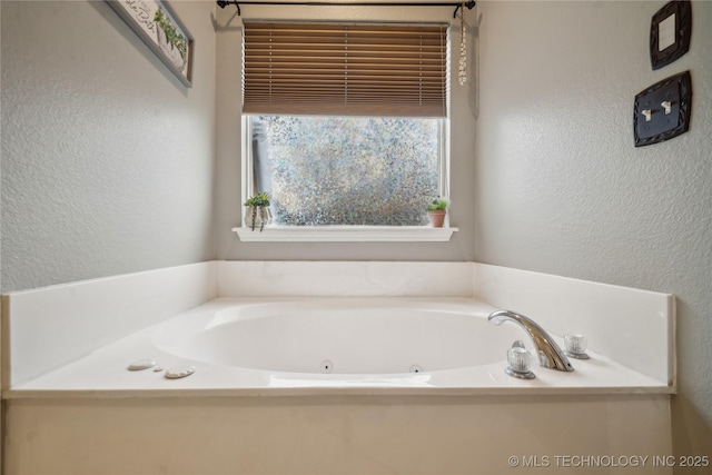 bathroom featuring a washtub