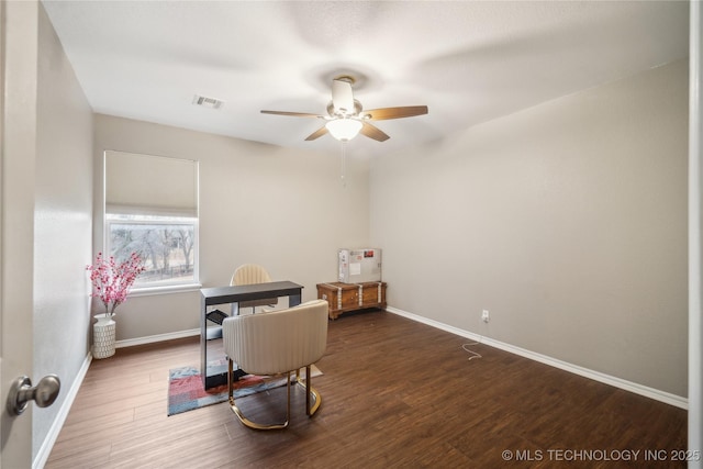 office space with ceiling fan and dark hardwood / wood-style floors