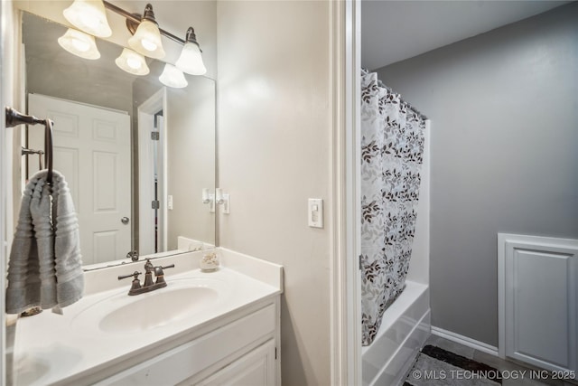 bathroom featuring vanity and shower / bath combo with shower curtain