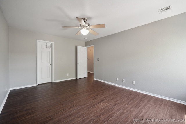 unfurnished bedroom with visible vents, a ceiling fan, baseboards, and dark wood-style flooring