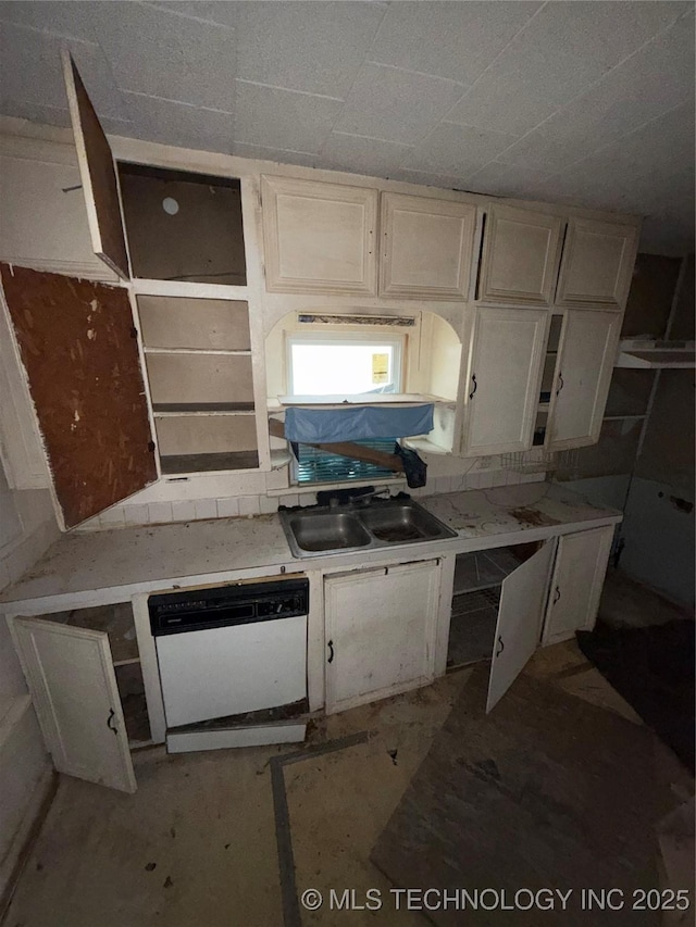 kitchen featuring sink, white cabinets, and dishwasher