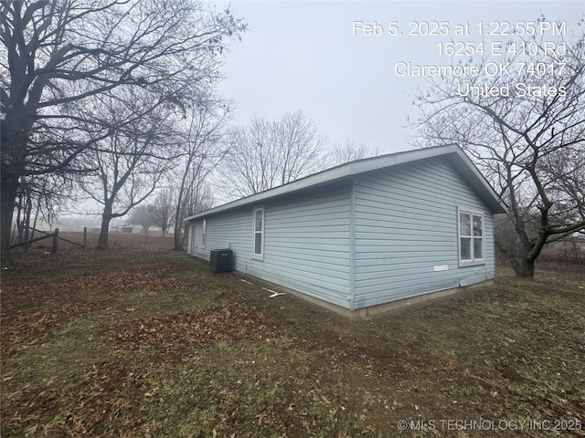 view of side of property with central AC unit