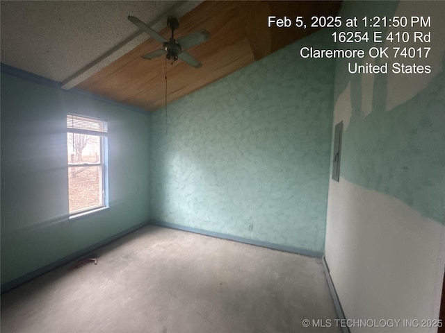 spare room featuring lofted ceiling and ceiling fan