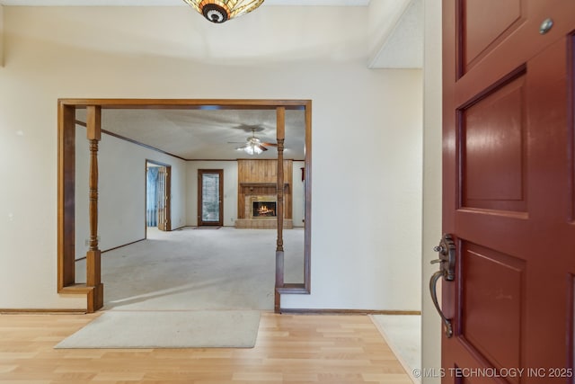 entryway with light hardwood / wood-style flooring and ceiling fan