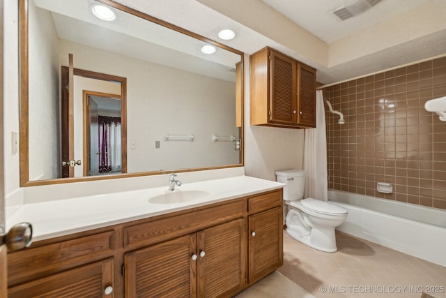 full bathroom with tile patterned flooring, vanity, shower / bath combo with shower curtain, and toilet