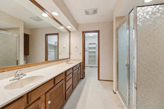 bathroom with vanity and walk in shower