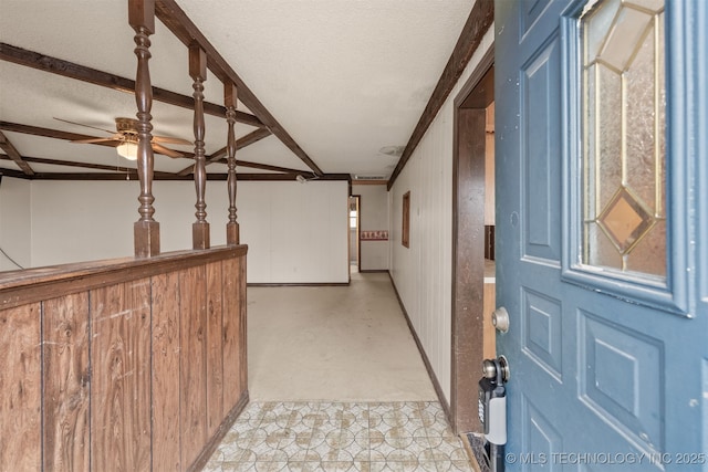 hallway with a textured ceiling