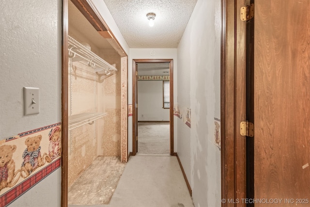 corridor with a textured ceiling