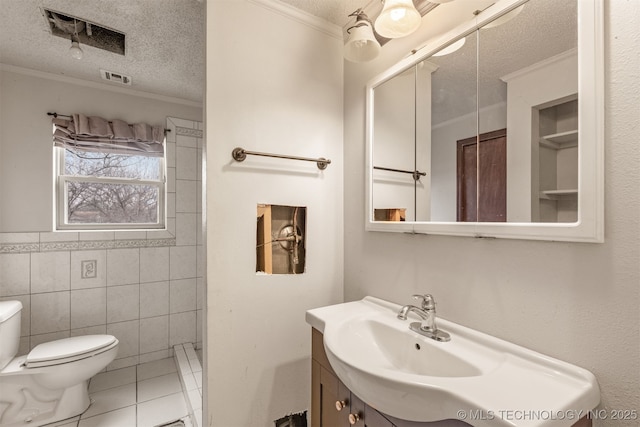 bathroom featuring tile walls, tile patterned flooring, vanity, crown molding, and a textured ceiling