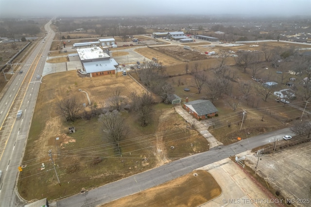 birds eye view of property featuring a rural view