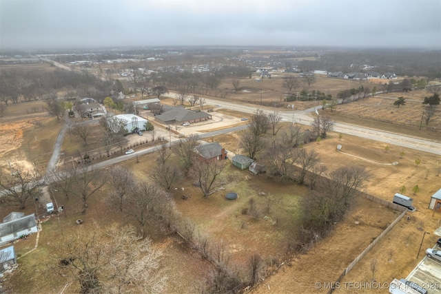 birds eye view of property with a rural view