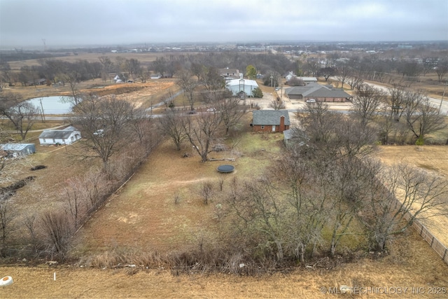 birds eye view of property featuring a rural view and a water view