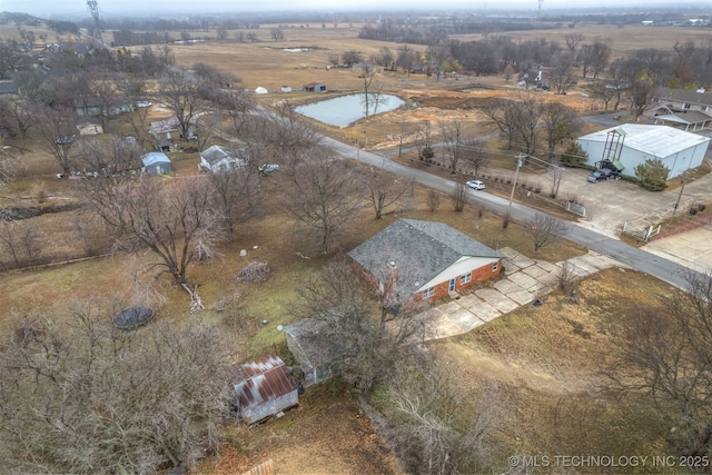 birds eye view of property with a rural view