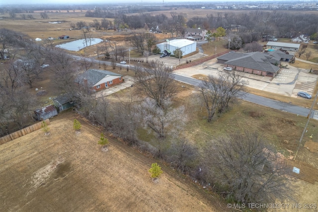 birds eye view of property with a rural view