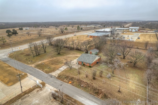 birds eye view of property featuring a rural view