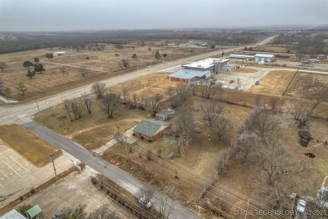 birds eye view of property with a rural view