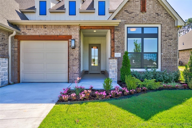 view of front of property with a garage and a front yard