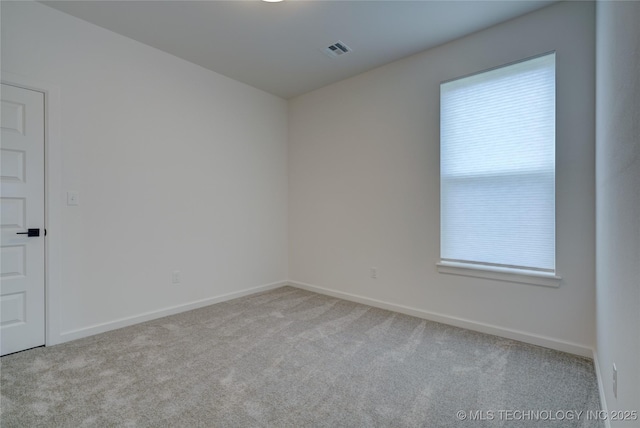 unfurnished room with light colored carpet