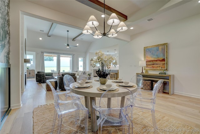 dining space featuring beamed ceiling, ceiling fan with notable chandelier, and light hardwood / wood-style floors