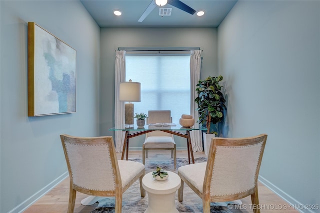 living area featuring ceiling fan and light wood-type flooring