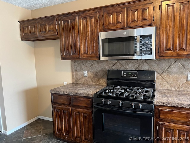 kitchen with tasteful backsplash and black gas range