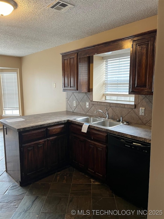 kitchen featuring dishwasher, dark brown cabinets, sink, and kitchen peninsula