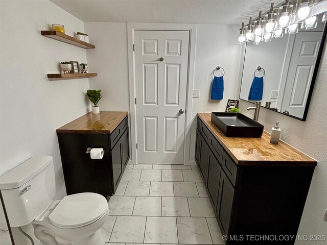 bathroom featuring sink and toilet