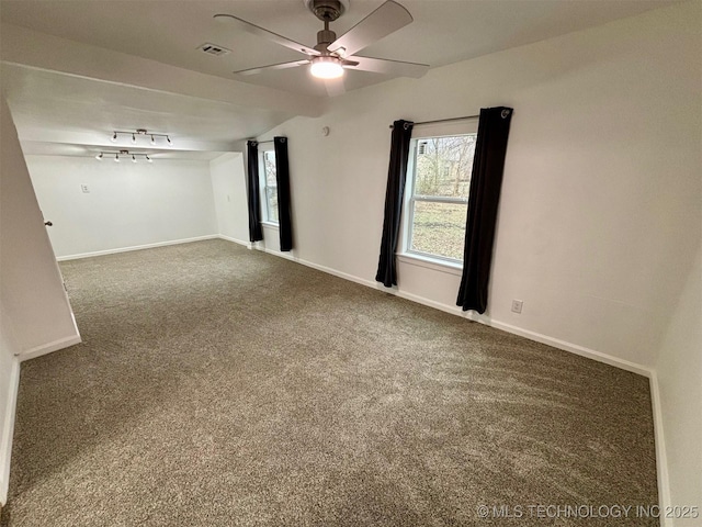 spare room with ceiling fan, carpet floors, and a healthy amount of sunlight