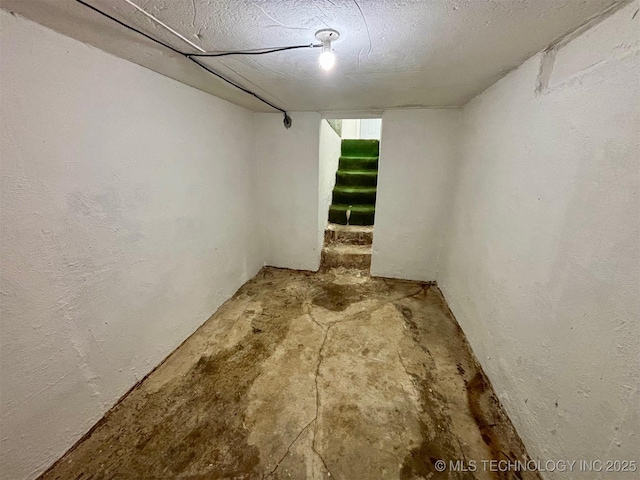 basement with a textured ceiling