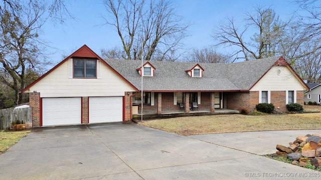 view of front of house with a garage and a front yard