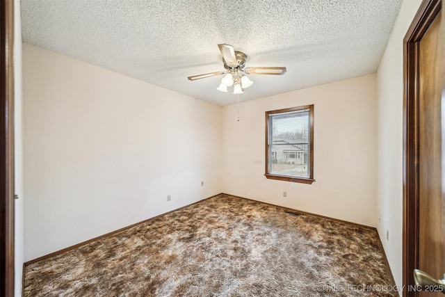 unfurnished room featuring ceiling fan, carpet floors, and a textured ceiling