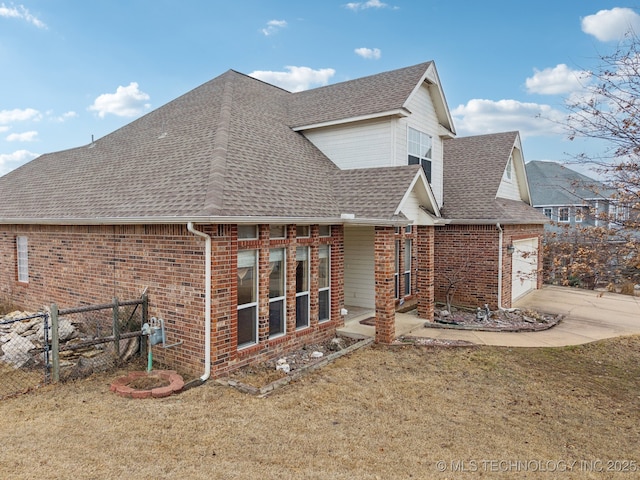 back of house with a yard